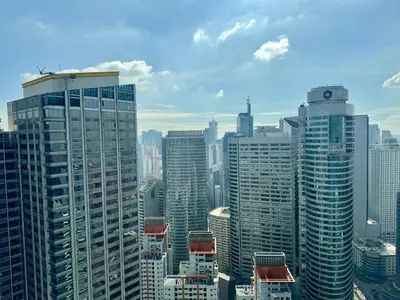 a view of a large city with tall buildings at City Bliss Chill Vibes Makati 5338 Netflix Swim Gym Park Superfast Net in Manila