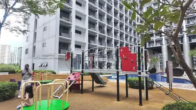 a playground in front of a apartment building at Iyashi Pod in Manila