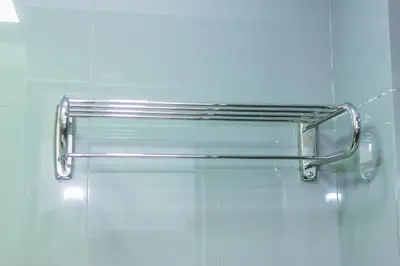 a glass shelf on a wall in a bathroom at Air Dream Den Good Vibes Makati Gym Swim Park Superfast Internet 3870 in Manila