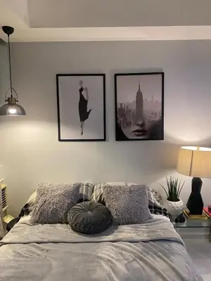 a bedroom with pictures on the wall and a bed at Beach Condo at Azure Urban Resort with SmartTV in Manila