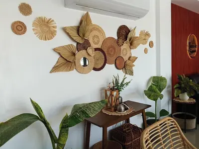 a room with a table and some plants on a wall at tierra de segundo in Binangonan
