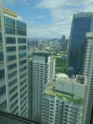 an aerial view of a city with tall buildings at Alphaland Suites Apartment Hotel in Manila