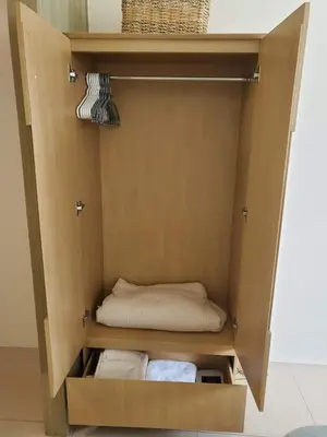 a cupboard with a bed and towels in it at Group Stay by Metro Staycation in Manila
