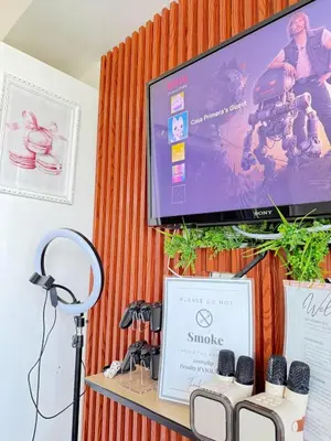 a flat screen tv hanging on a wall at Isla Cabana Azure Staycation in Manila