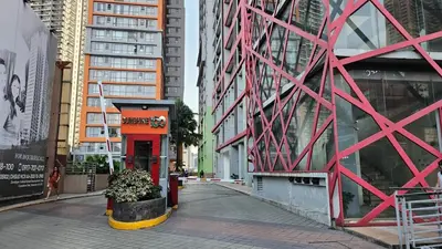 a street in a city with tall buildings at Chic Studio near Megamall and Shangrila Plaza in Manila