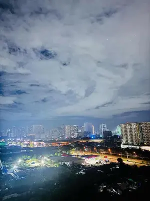 a view of a city at night with lights at Shore 2 Residence in Manila