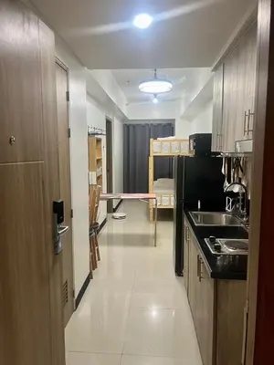 a kitchen with a sink and a counter top at 1 Br Family Suite in S Residences by JMS in Manila
