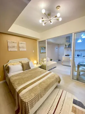 a bedroom with a bed and a ceiling fan at Azure Staycation PH 1503 in Manila