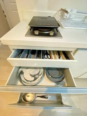 an open refrigerator drawer with a laptop on top at Azure Staycation PH 1503 in Manila