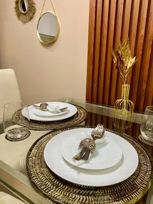 a glass table with two plates on top of it at Azure Staycation PH 1503 in Manila