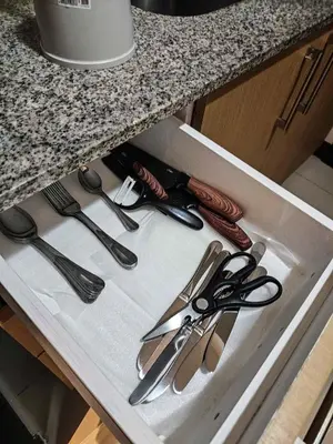 a drawer with scissors and other kitchen utensils at Spacious 3BR Suite in Uptown BGC with King Size Bed, near Malls and Restaurants in Manila