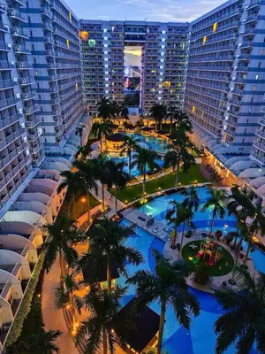 an aerial view of a resort with palm trees and buildings at 2bedroom with big balcony 1046D pool view in Manila