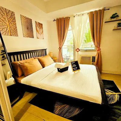 a bedroom with a bed with a sign on it at Azure Urban Resort Residences by Moldez Staycation in Manila