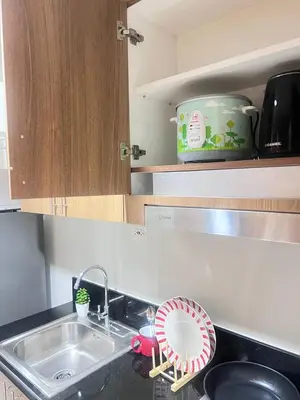 a kitchen sink with a fan on the counter at Unistay SHORE 3 Tower 2 10th Floor w Balcony Pool View in Manila
