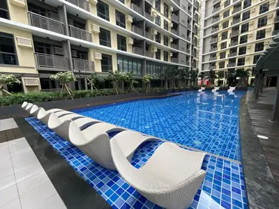a swimming pool in the middle of a building at 1BR Executive Suite Beside Okada & Solaire - 4pax in Manila