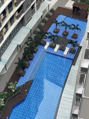 an overhead view of a pool in a building at Spacious 1BR near Airport across Okada, Solaire in Manila