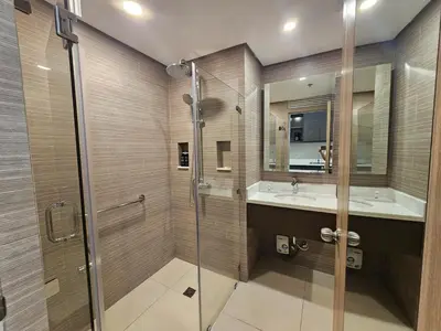 a bathroom with a shower and a sink at The Residences at BCCT by Stays PH Cozy retreat with hotel-style comforts and convenience, best location in BGC in Manila