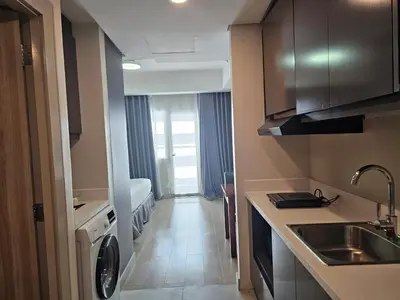 a small kitchen with a sink and a counter top at The Residences at BCCT by Stays PH Cozy retreat with hotel-style comforts and convenience, best location in BGC in Manila