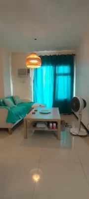 a living room with a couch and a table at The Radiance Manila in Manila