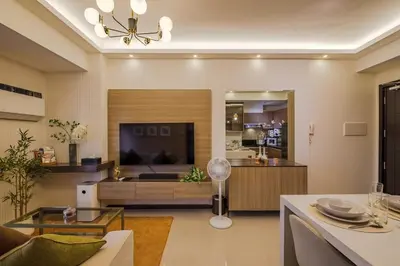 a living room with a couch and a television at EC Suites Modern 1Br Suite w Balcony in Pasay in Manila