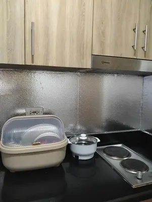 a kitchen counter with a bowl and a container on a stove at Staycation at Shore 2 Residences Tower 1 Near Moa, PICC, STARCITY, WORLD TRADE, SMX, MOA ARENA & NAIA 123 in Manila