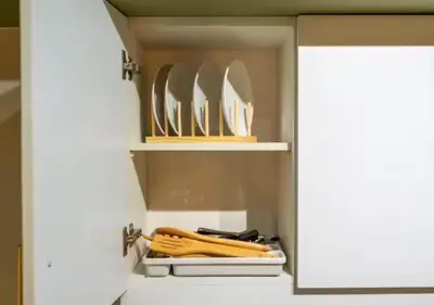 a cupboard with a bunch of knives in it at Villa Verde, Tivoli Garden Residences in Manila