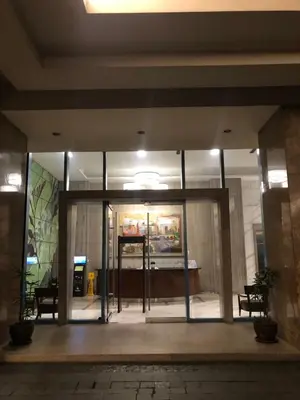 an entrance to a building with glass doors at South Sanctuary in Manila