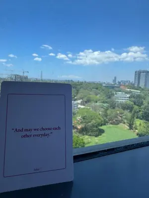 a window with a sign that reads and may we discharge each other everyday at Industrial Chic Studio in McKinley Hill Walk to Venice Mall in Manila