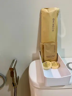 a paper bag sitting on top of a toilet at Condo unit near SM City Sta Rosa unit 3 in Santa Rosa