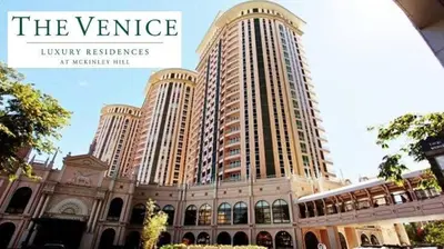 a large building with three tall buildings at The Serene Casa - EMANUELE TOWER in Manila