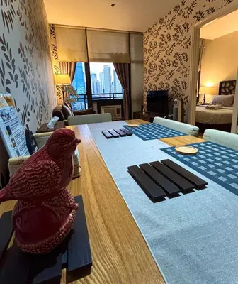 a bird sitting on a table in a room at Spacious 1BR APT near Nightlife and Business Center in Makati in Manila