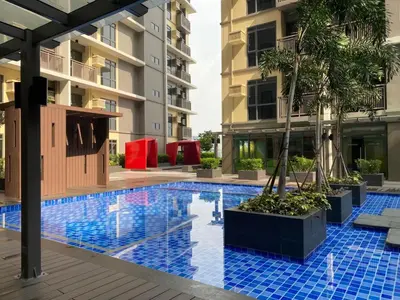 a swimming pool in the middle of a building at 2mins to Okada near Airport & MOA with Balcony-8E in Manila