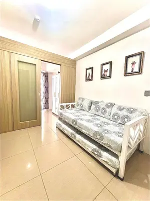 a bedroom with a bed in a room at Shore 1 Condo near MOA - PLS send valid IDs of all guests after booking for guest authorization form purposes in Manila