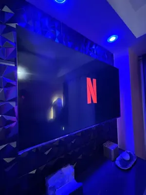 a tv with the n on it in a blue room at Azure Urban Resort Residences - Staycationary Miami 1710 in Manila