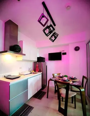 a kitchen with a table and a purple ceiling at Azure Urban Resort Residences by Staycationary 17th floor Miami in Manila