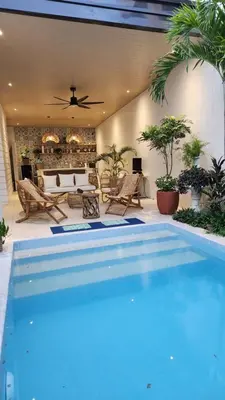 a swimming pool in the middle of a living room at Nazville Vacation Home in Cainta