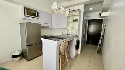 a kitchen with a sink and a refrigerator at Avida Towers Intima Paco, Manila Studio Unit in Manila