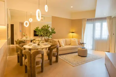 a living room with a couch and a table at Cozy Flat at Makati s Coolest St in Manila
