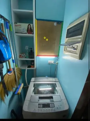 a kitchen with a toaster oven in a refrigerator at One Palm Tree Villas Near NAIA 3 in Manila
