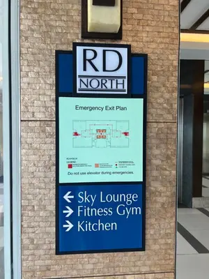 a sign in front of a building that reads sky lounge fitness gym kitchen at CASA ROYALE Affordable Condo Near BGC Ortigas Center CBD in Manila