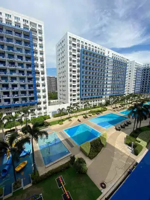 an aerial view of a large apartment building with a pool at Bj's Staycation Manila - SEA Residences SM MOA in Manila