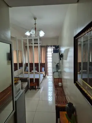 a living room with a couch and a table at Breeze Residences, Pasay City in Manila