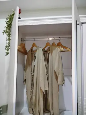 a closet filled with lots of clothes at Seaside Serenity in Manila