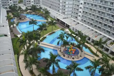 an aerial view of the pool at the resort at Amazing View 2br MOA, 98 sqm XBOX 200mbps, Printer in Manila