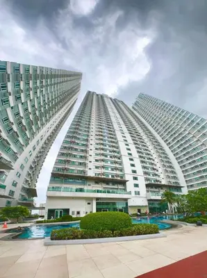 a large building with two tall buildings at The Beacon Tower in Manila
