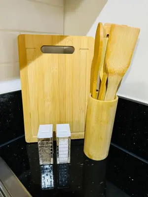 a knife block sitting on top of a kitchen counter at Fame residences in Manila