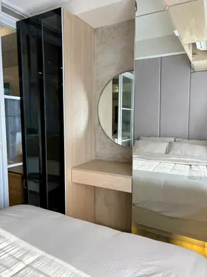 a bedroom with a mirror and a bed and a bed sidx sidx sidx at 1LDK Air Studio in Makati City in Manila
