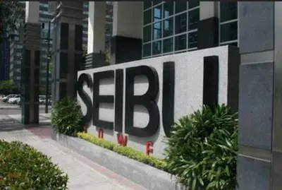 a large sign on the side of a building at Central BGC - Spacious Modern 2 bedrooms 2 bathrooms with Balcony in Manila