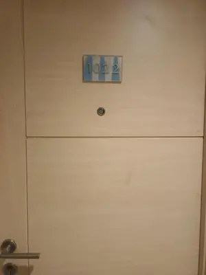 a door with a clock on top of it at Sea Reaidence Tower E in Manila