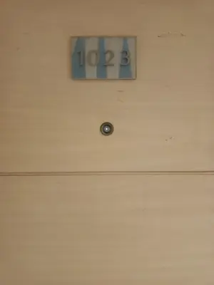 a door with a lock and a clock on the wall at Sea Residence Tower EF in Manila